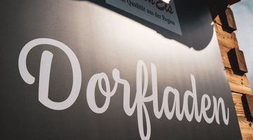 Dorfladen Schild